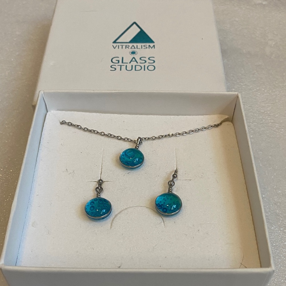 Vitralism Glass Studio jewelry set features aqua-blue glass pendants.